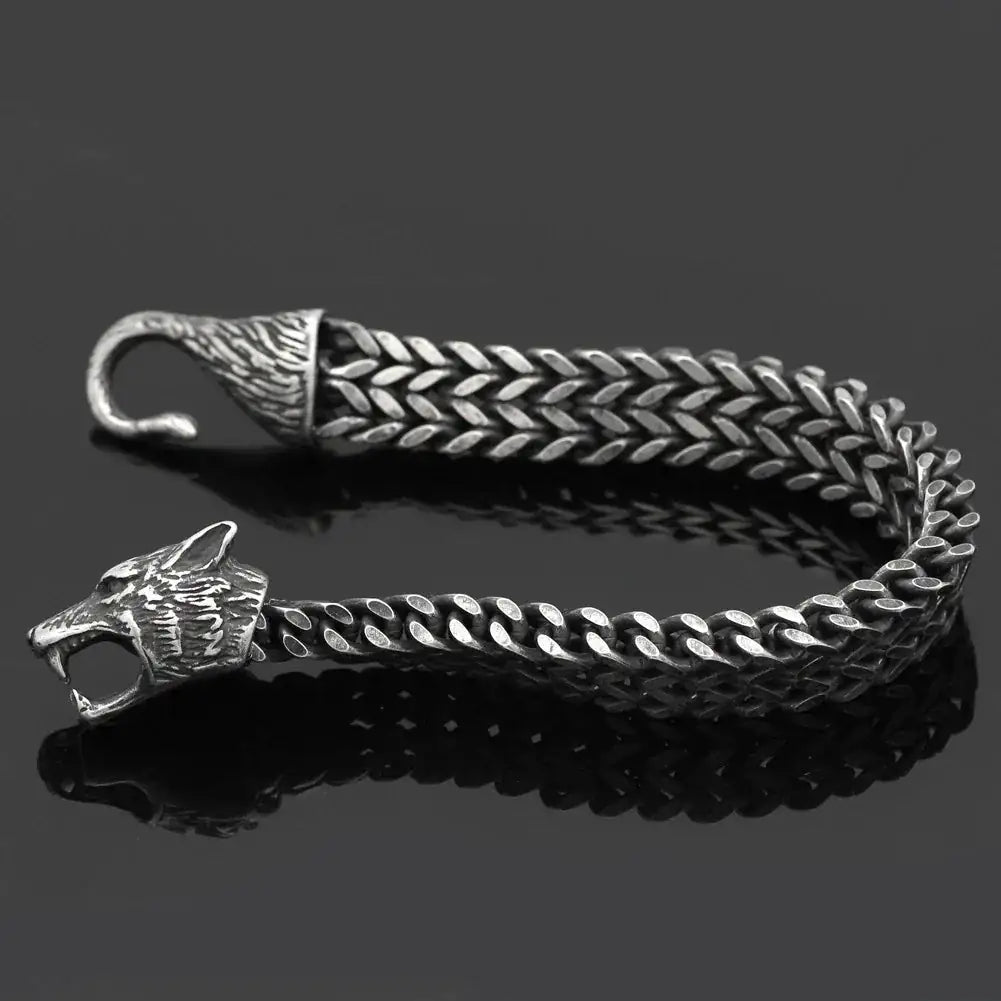 Men’s Wolf Head Bracelet showcased with a stainless steel Cuban chain design, symbolizing power and strength.