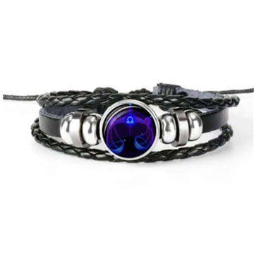 Luminous Zodiac Bracelet showcasing a glow in the dark astrology design with intricate braided leather and silver accents.