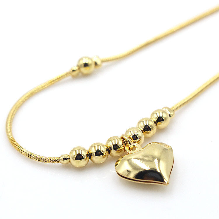 Beaded chain anklet laid flat on a white background